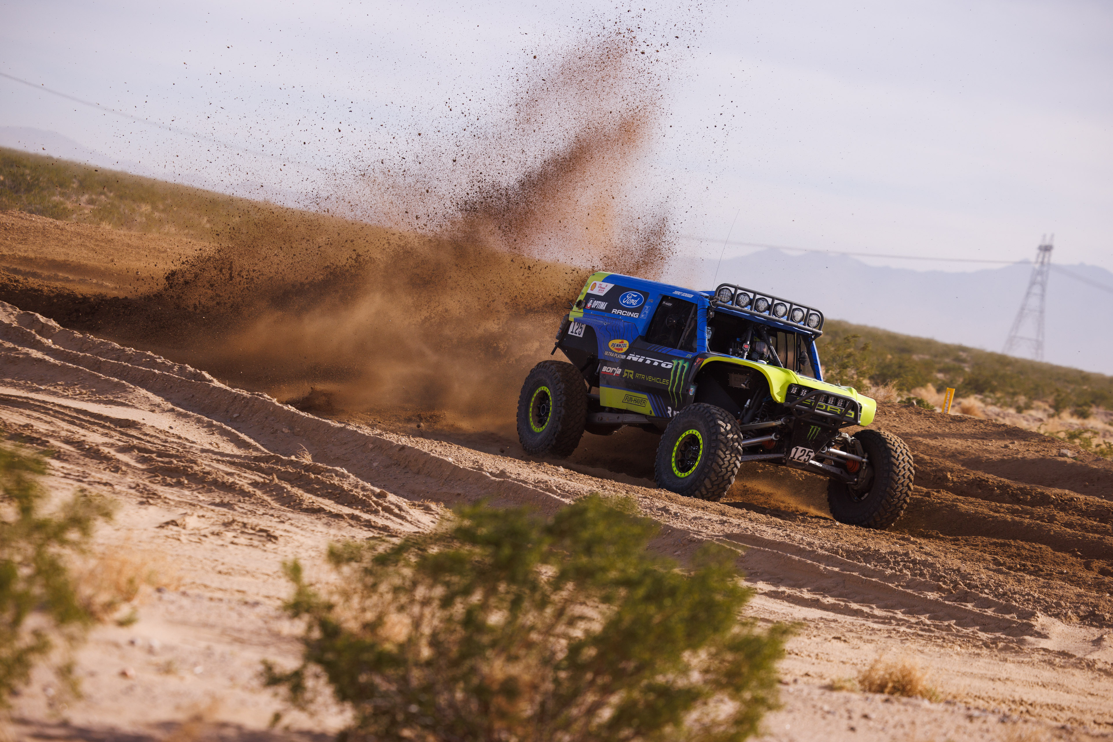 Mint 400 - Vaughn Gittin Jr with rooster tail behind Raptor 4400